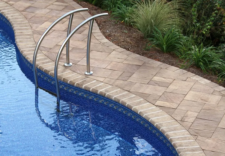 Coastal Tan coping stones along a pool edge at a Virginia Beach residence, featured in coping project photos.