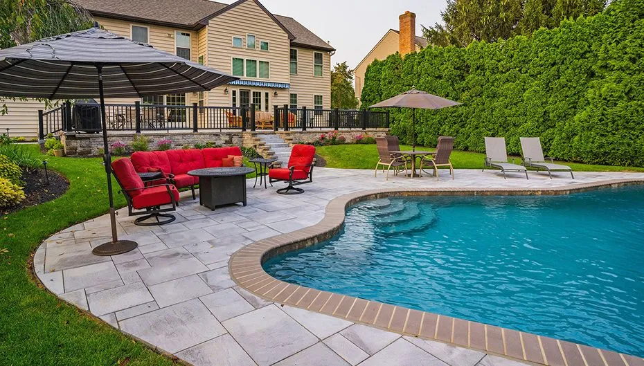 Flagstone steps, pavers, and a retaining wall at a Lancaster, PA residence, featured in project photos.
