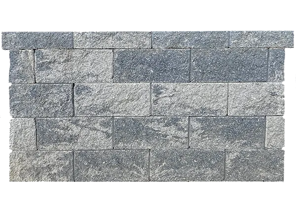 A wall of CornerStone® 100 retaining wall blocks featured in the Walls section.